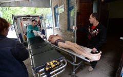 Раненый в ходе боестолкновений ополченец © РИА Новости, Михаил Воскресенский