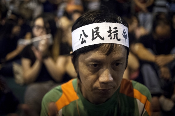 Сторонник протестного движения Occupy Central во время митинга в районе Admiralty в Гонконге © РИА Новости, Валерий Мельников