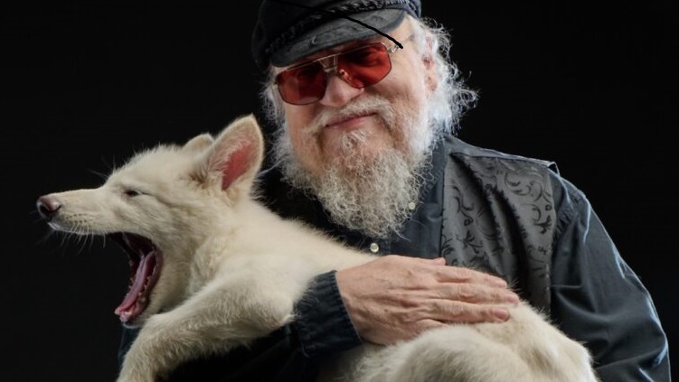 Фото © Social media page of George R.R. Martin Писатель Джордж Мартин и один из щенков лютоволка
